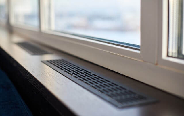 HVAC grid installed near window